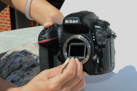 Nikon VAF filter being installed in a DSLR camera
